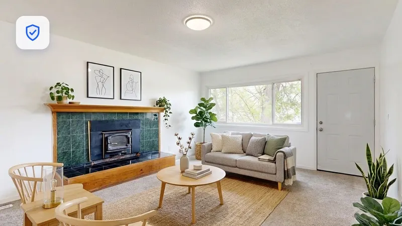 A staged living room with a verified badge, showing honest virtual staging