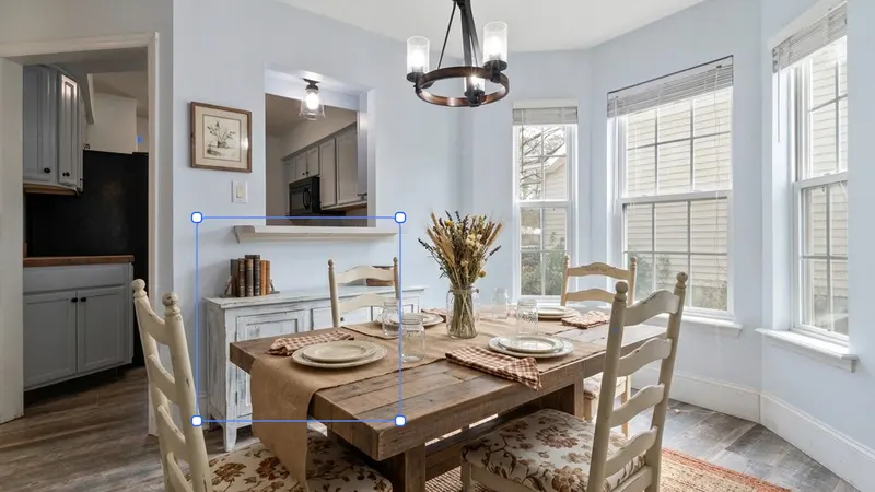 A staged dining room with an AI selection box highlighting furniture